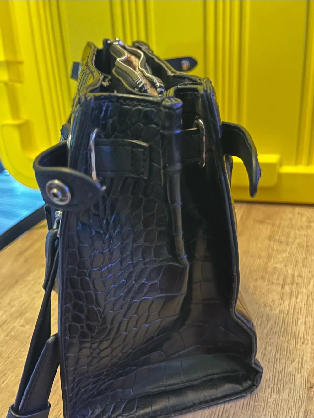Guess Black Embossed Satchel Bag in good condition except missing one button